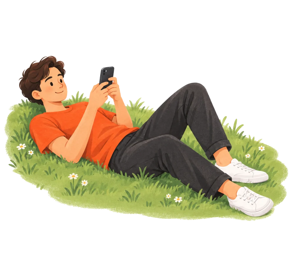 A person lying on the grass, relaxed, looking at their phone